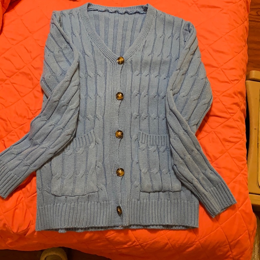 Women’s blue Amazon sweater size medium.